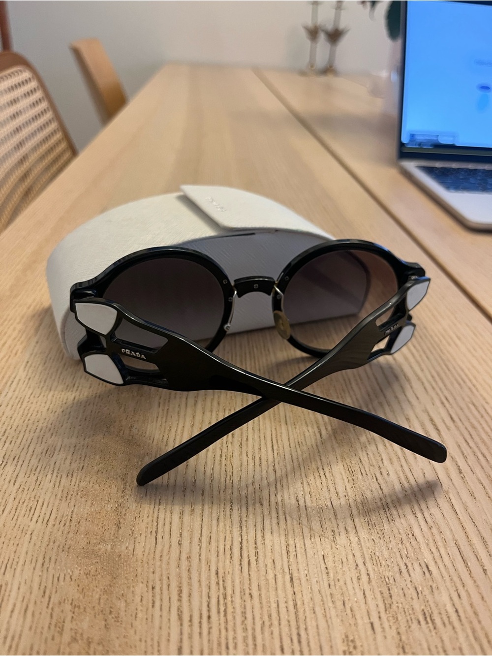 Prada Black Round Sunglasses with Gradient Lenses and White Temple Accents